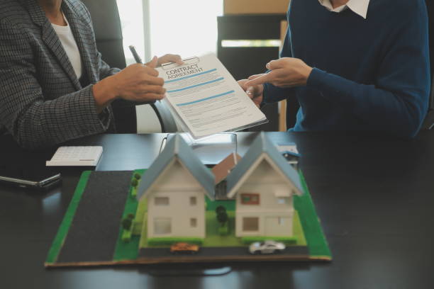 Team of architectures and businessmen discussing and brainstorming on floor plan modification for real estate investment and housing development project